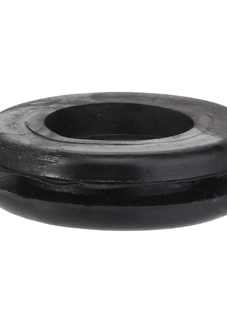 Close-up image of the AGCO Grommet - La10396480 with a central hole and a circular shape, in black rubber. No Product Description Available.