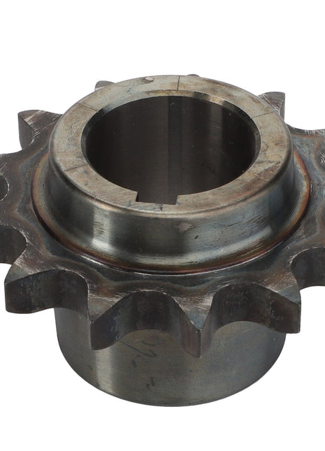 The AGCO | Sprocket - La300114384, a metal sprocket gear with 11 teeth and a central cylindrical hole for mounting, is shown against a plain white background. No current product description available for this product.