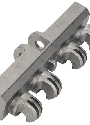 The AGCO | Spring Suspension - F222502031020, by AGCO, is a metal component with a rectangular base that features four claw-like protrusions attached to the bottom, reminiscent of industrial machinery.