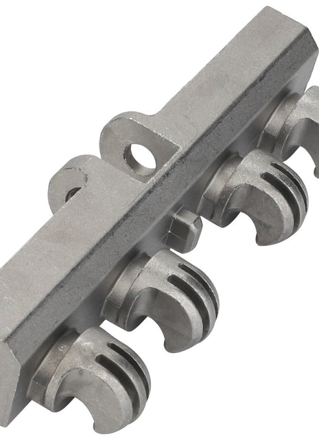 The AGCO | Spring Suspension - F222502031020, by AGCO, is a metal component with a rectangular base that features four claw-like protrusions attached to the bottom, reminiscent of industrial machinery.