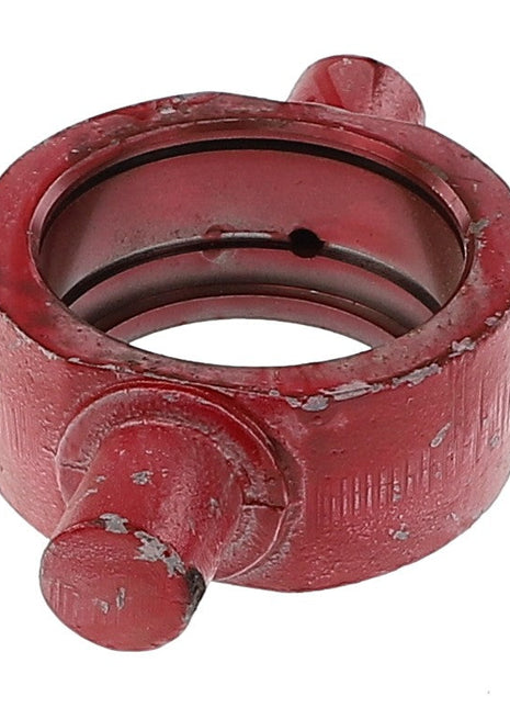 A weathered AGCO bearing (Model E753) with a red metal finish and two protruding lugs shows visible wear and tear.