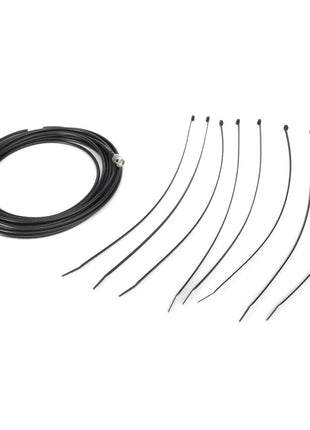 AGCO | ANTIWINDER - AG137145 coiled black cable with connectors on both ends, accompanied by seven black zip ties arranged in a row.