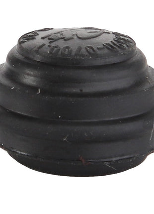 The AGCO | CAP - D45908600, a small, round black rubber device with ridges and embossed text on the top, comes without additional product information.