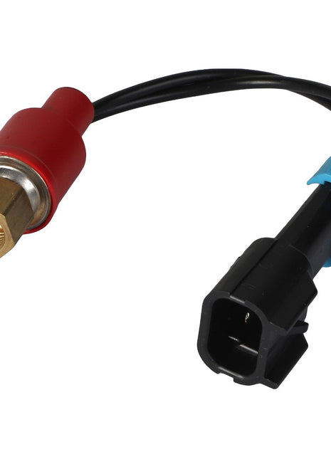 Close-up of the AGCO AIR CONDITIONING HIGH PRESSURE SWITCH - AG262906, highlighting its distinctive red housing, brass fitting, and an attached wire that leads to a black and blue electrical connector.