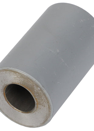 The AGCO SPACER - AG109903, featuring a hollow center and a grey surface, is showcased against a pristine white background.