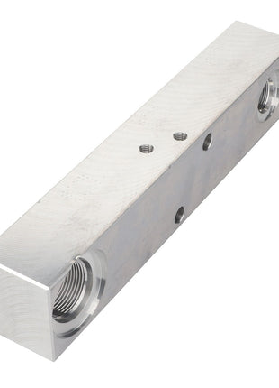 The AGCO | Valve Block - Acw383234B is a rectangular metallic block featuring threaded holes and smaller drilled holes along its length, designed for versatile applications.