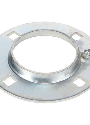 The AGCO FLANGE - EP6577, a metal flange, is ideal for agricultural applications. It features a central circular opening, four square notches around the perimeter, and a small protruding screw on the outer ring. Perfect for Flangette assemblies, this flange is zinc plated to ensure corrosion resistance.