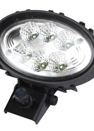 The AGCO | Worklight - Acw3760890 is an oval-shaped LED work light with a black casing, featuring six individual LED lights arranged in two rows of three, and mounted on a small adjustable bracket.