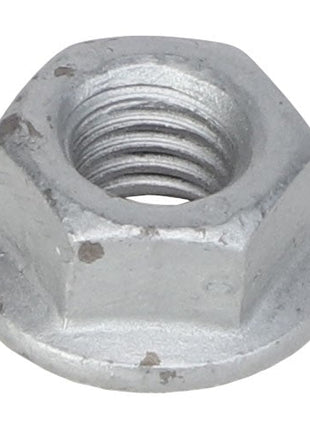 A close-up image of the AGCO Hex Flange Nut - Acw1027140 reveals its hexagonal shape and threaded interior, featuring slight surface blemishes and a grayish tint.