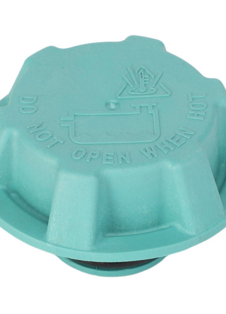 Close-up of the AGCO | Tank Cap - F530200050600, depicting its green color and featuring the warning "DO NOT OPEN WHEN HOT" alongside a symbol of a hand near steam on its surface.