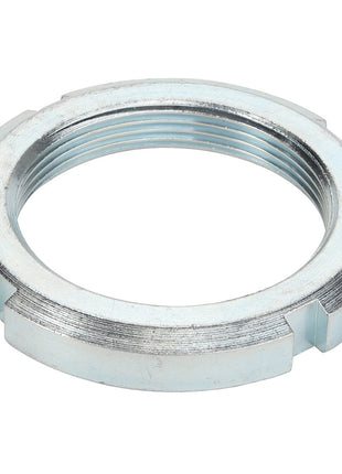 The AGCO Locknut - Acp0411060 is a silver metal threaded locknut featuring four evenly spaced indents around its outer edge. Further product description is not currently available.