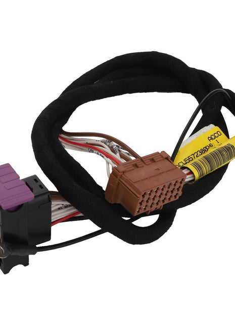 The AGCO |  Harness - Acw5572380, an advanced coiled wiring harness by AGCO, features multiple connectors, including a brown plug and a black plug with a purple tab. Current product description information is not available for this item.