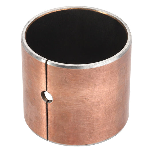 The AGCO Bush - Acp0287020 is a cylindrical metal bushing with a slit and a small circular hole on the side, featuring a copper-colored outer surface and a black inner surface.