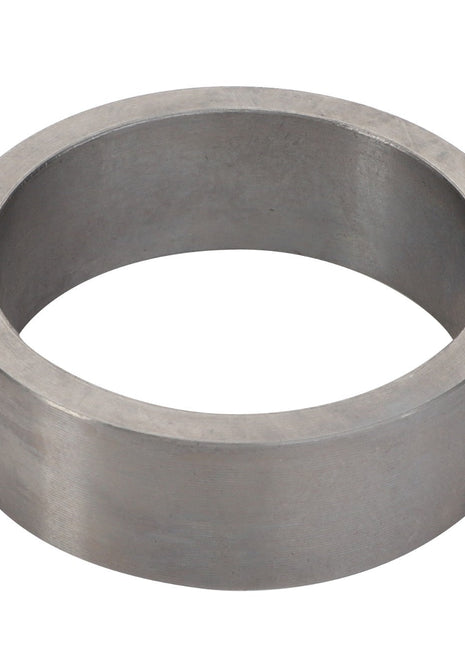 The AGCO | RING - F743300021160 is a metal cylindrical ring with a hollow center and smooth surface.