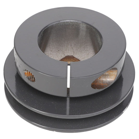 A close-up view of the AGCO Sheave - Acx2766610, a black cylindrical metal object with a hollow center and circular cutouts on the sides.
