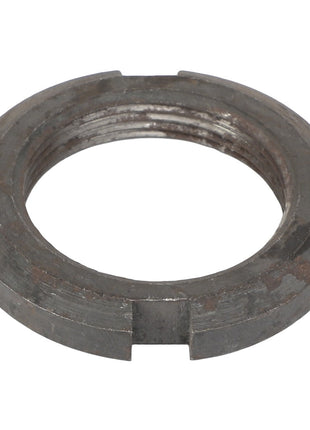The AGCO NUT - 1132990 is a metal locking nut featuring four notches around its edge. No further product description is available.