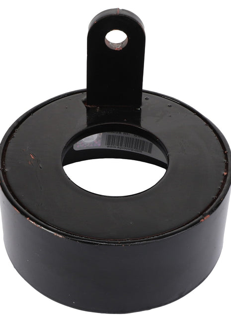 The AGCO Wheel Seal Protector - Sn16853 is a sleek black metal circular object with a central hollow section and an upper tab featuring a hole for convenient attachment.