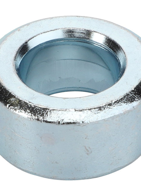 Introducing the AGCO Spacer - Acp0520550: A sleek, metallic, cylindrical spacer with a central hole and a surface boasting a shiny silver finish.