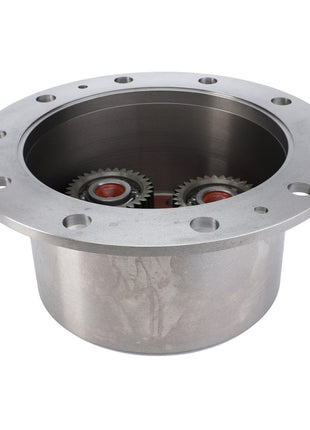 The AGCO Planetary Carrier - F743300020650 features a metal cylindrical design with multiple holes around the top rim and two visible cogwheels inside.