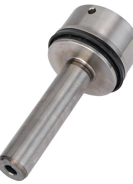 The AGCO | PRESSURE PISTON - F903152070030 is a cylindrical metallic machine part with a wider top section, featuring a black ring near the middle.