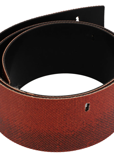 This durable, rolled-up AGCO | Cover Seal - Acw169829C in brown leather features a unique textured pattern and multiple belt holes.