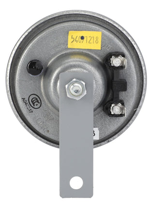 An AGCO Horn - F238900020043 is a circular metal industrial part featuring a mounting bracket and two electrical connectors. The top is marked with a yellow label displaying the number "34971218." No current product description is available.