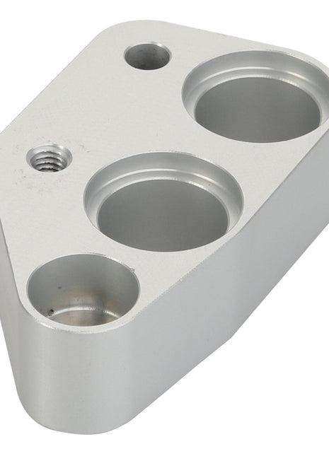 The AGCO Spacer - Acx2416060 from the brand AGCO is a sleek, metallic component with a geometric shape, featuring three circular indentations and one threaded hole.