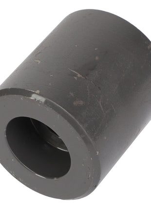 A cylindrical metal object with a hollow center and a slightly rough, dark gray surface that resembles industrial craftsmanship, branded as AGCO and identified by the product name FRONT AXLE - AL10391922.