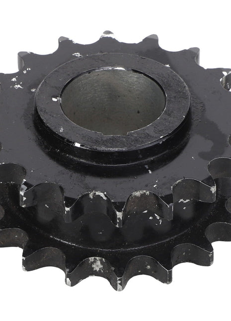 A black metal sprocket with visible wear and tear on its teeth, photographed on a white background. This product is an AGCO | Sprocket - Acx2433580 by the brand AGCO. No current product description information is available.