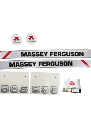 A variety of AGCO decals, specifically designed for the Massey Ferguson 985 Front Loader (AL11133963), featuring factory-engineered brand name decals, circular logos for optimal visibility, "985" number decals, and a safety warning label.