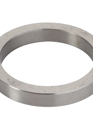 The AGCO | INTERMEDIATE RING - V30386900, a metallic circular washer featuring a substantial central hole, is depicted from an angled view against a plain white background. Detailed product description information is currently unavailable for this item.