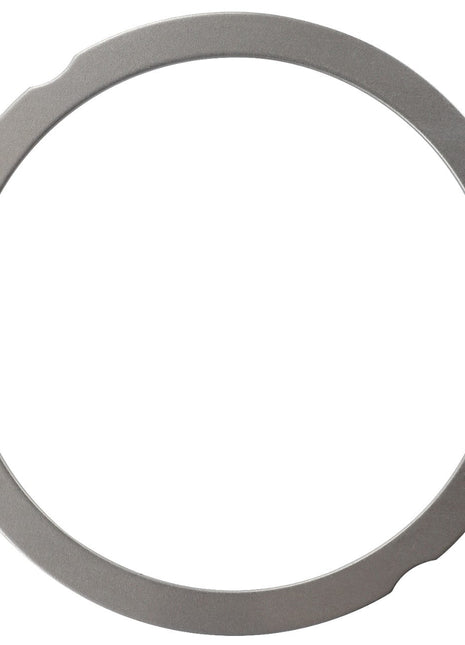 A flat, circular metal ring known as the AGCO Compensating Ring - F148200210190, featuring slight notches on the outer edge and minor wear on the surface. No current product description available.
