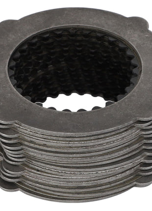 A set of AGCO | Set Of Fins - F416300020010, featuring uniformly stacked gray metal friction plates with grooved inner circles. No Current Product Description Available.