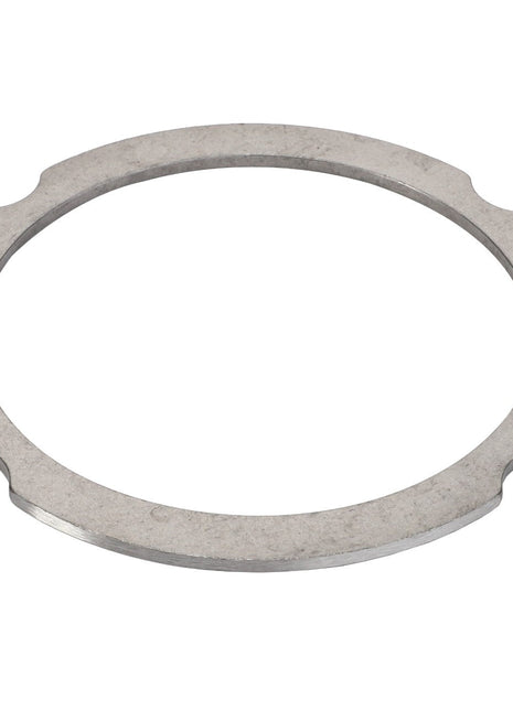 The AGCO Compensating Ring - F007200210310 is a flat, circular metal washer featuring four symmetrical cutouts around its edge. No current product description is available for this item.