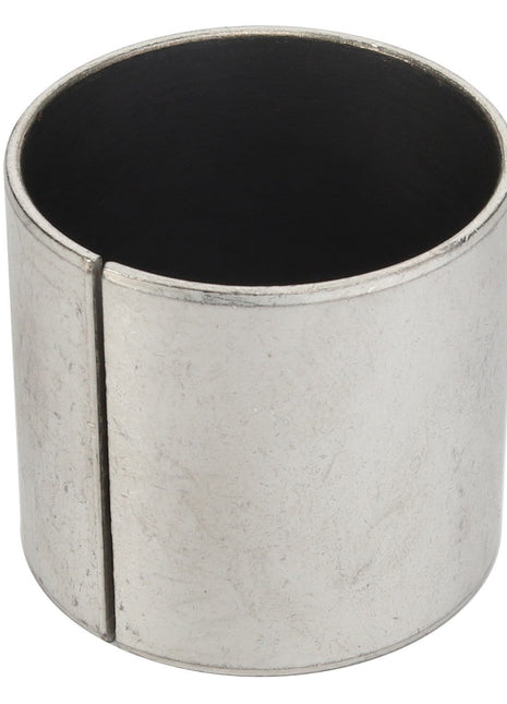 The AGCO | BUSH - D43338400 is a cylindrical metal bushing with a vertical slit on one side. Its surface is smooth and reflective, showing only slight wear marks. No additional current product description information is available from the brand AGCO.