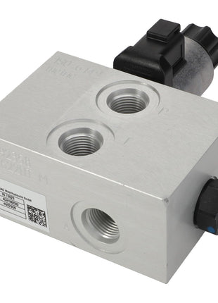 Close-up view of the AGCO Valve Block - Acw1982320, a rectangular metal hydraulic valve block with multiple ports and a black electronic connector on top. No current product description information is available.