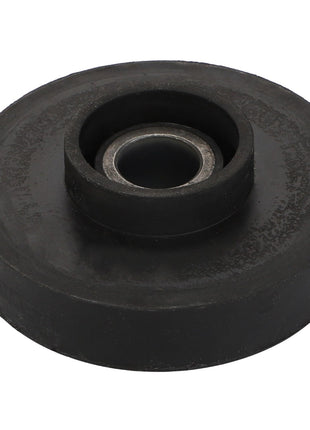 The AGCO Vibration Mount - Acp0674250 features a sleek black rubber wheel with a central metal bearing, viewed from above.