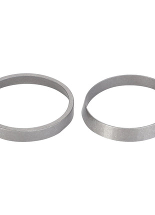 Two silver, circular metal components, one flat and one conical, are placed side by side on a white background. These components exemplify AGCO Parts Genuine quality, ensuring maximum uptime and peak efficiency for your machinery. Introducing the AGCO | Tightener, Beater Pulley - D42595900 from AGCO.