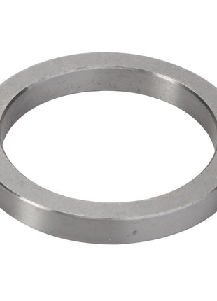 A circular, flat metal washer with a central hole, viewed from an angle against a pristine white background: AGCO | INTERMEDIATE RING - V30386200.