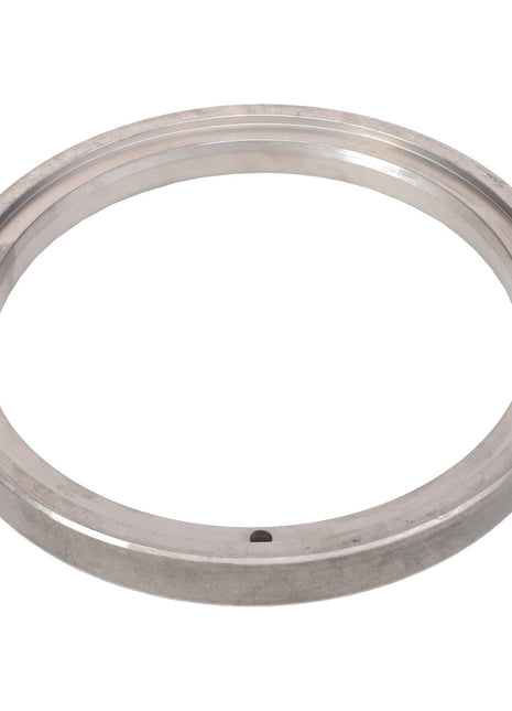 The AGCO | COLLAR - AG137232 features a sleek, metallic design with a smooth surface and a discreet hole on the bottom edge.