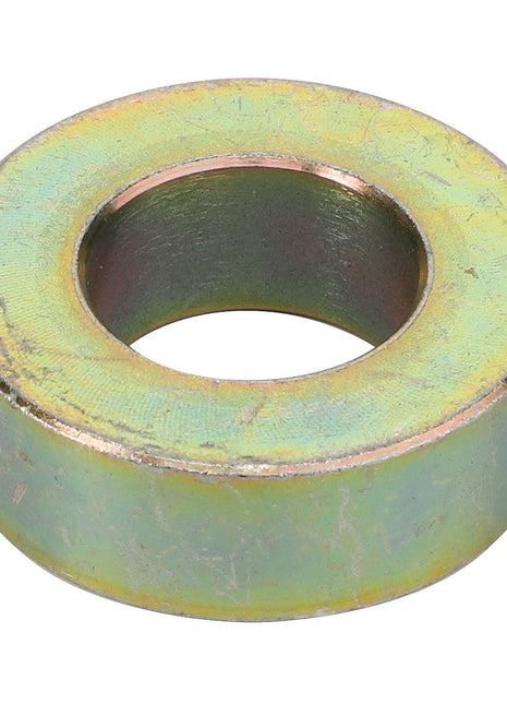 The AGCO | DISC - F718901010020, a metal washer with a circular shape and a hole in the center, features a slightly tarnished, yellowish surface with hints of green. Please note there is no additional product description information currently available.