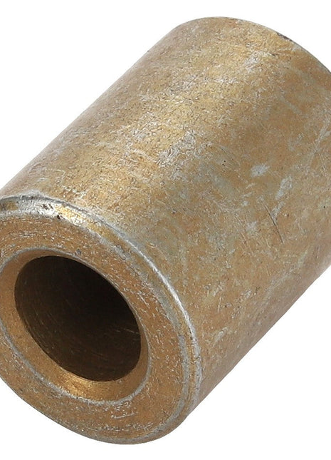 A cylindrical bronze bushing with a hollow center, viewed at an angle, identified as the AGCO SPACER - ACY1544410 from the brand AGCO. Currently, no additional product description information is available.