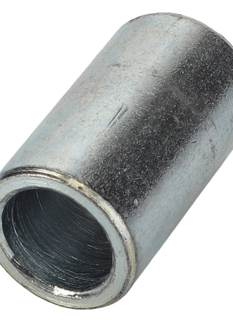 A metallic cylindrical spacer with a hollow core and a slightly textured surface, showing wear. Product: AGCO | Ratchet Jack Spacer Bushing - Sf10060015A, Brand: AGCO.