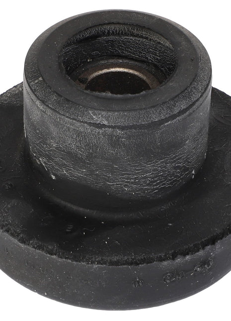 The AGCO | BONDED MOUNT - AG519387 is a round, black rubber bushing with a central metal insert, designed for applications requiring high precision.