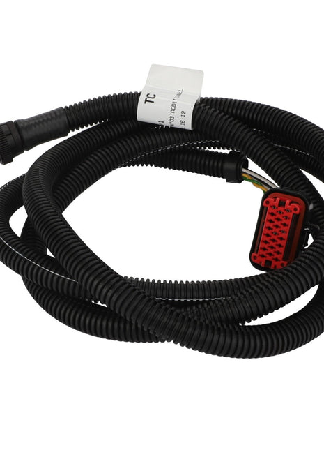 A coiled harness in black from AGCO, featuring multiple connectors — including a striking red one — and labeled "Harness - Acw150403A" with a white tag attached to the wires.