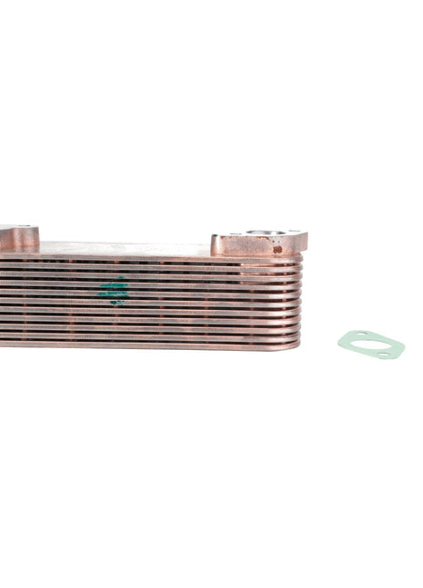 A rectangular, multi-layered metal heat exchanger, specifically the AGCO Oil Cooler - F530200230390, with two green gaskets beside it on a white background.