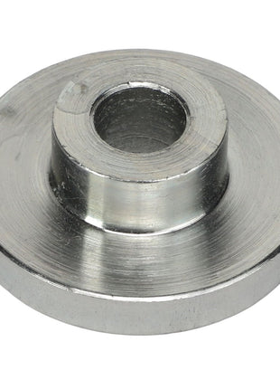 The AGCO Sleeve - Acp0295160 is a circular metal spacer with a central hole, featuring stainless steel construction and a raised middle section.