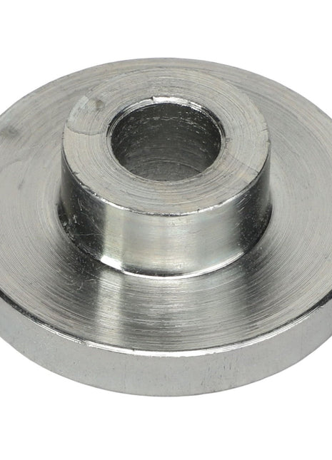 The AGCO Sleeve - Acp0295160 is a circular metal spacer with a central hole, featuring stainless steel construction and a raised middle section.