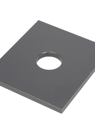 An AGCO plate, model E73212, featuring a perfectly round hole in its square metal design.