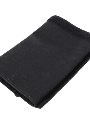 The AGCO HOSE COVER - AL60002977, a folded black fabric piece with a Velcro fastener, effortlessly blending style and functionality.